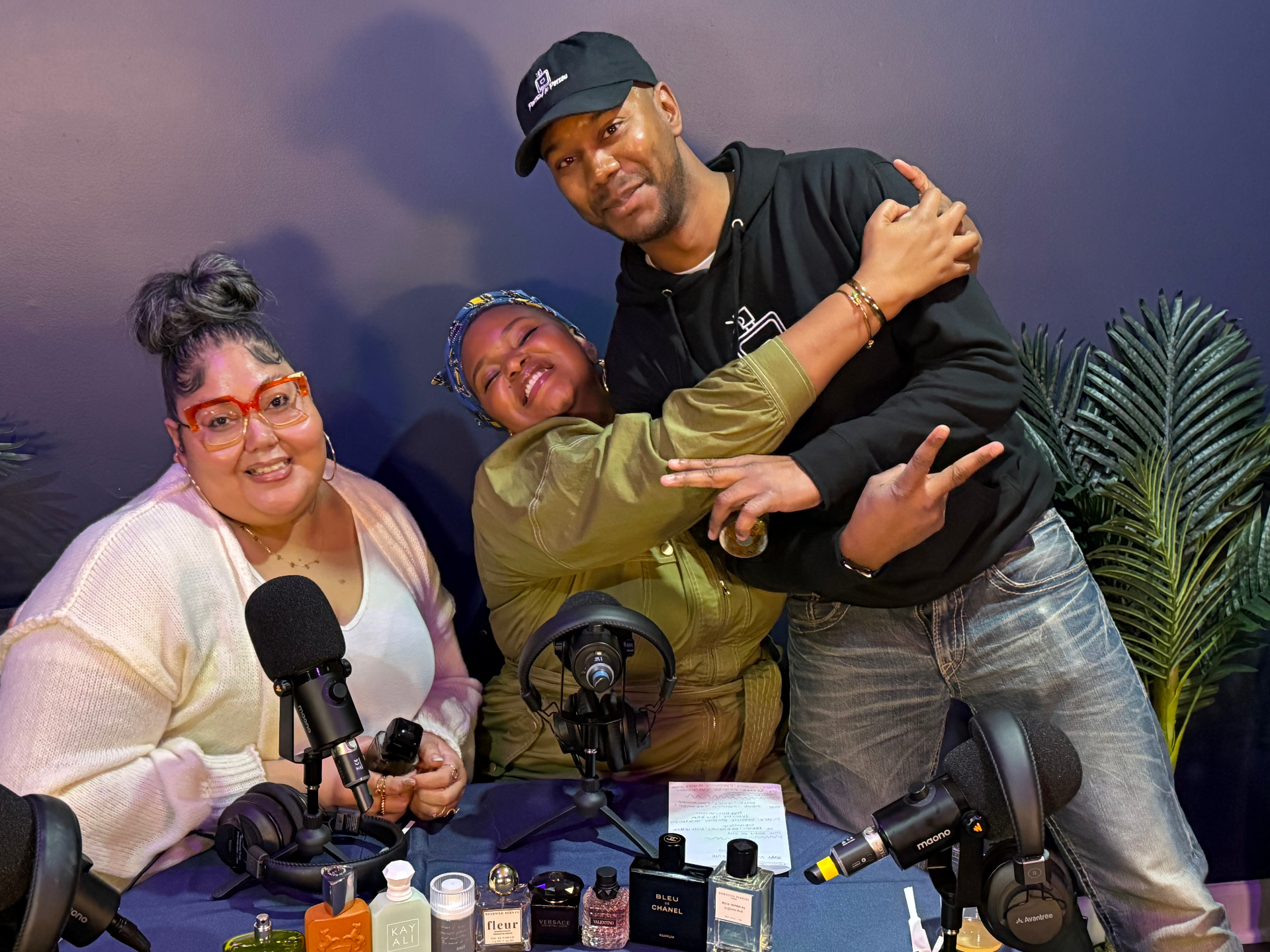 The Can We Be Fragrant crew posing together in the studio